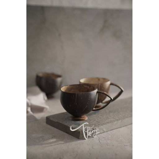 https://sg.fromindia.com/cdn/shop/files/Coconut-Shell-Tea-Cup-1-Piece-FromIndia-com-7587_512x512.jpg?v=1703160023